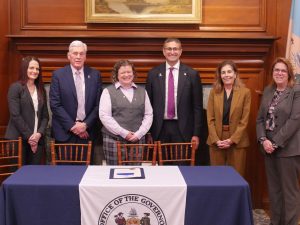 2025 Outstanding Service Award Recipient Jenn Kutney Soper with DVCC Chairs, Governor Meyer, AG Jennings and Rep. Griffith